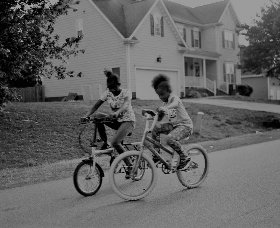 Photographer Laila AnnMarie Stevens’ nieces race down the neighborhood on their new bikes in Clayton, N.C.