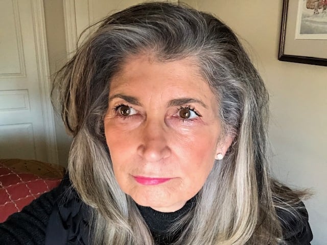 Head and shoulders portrait of a woman with grey hair