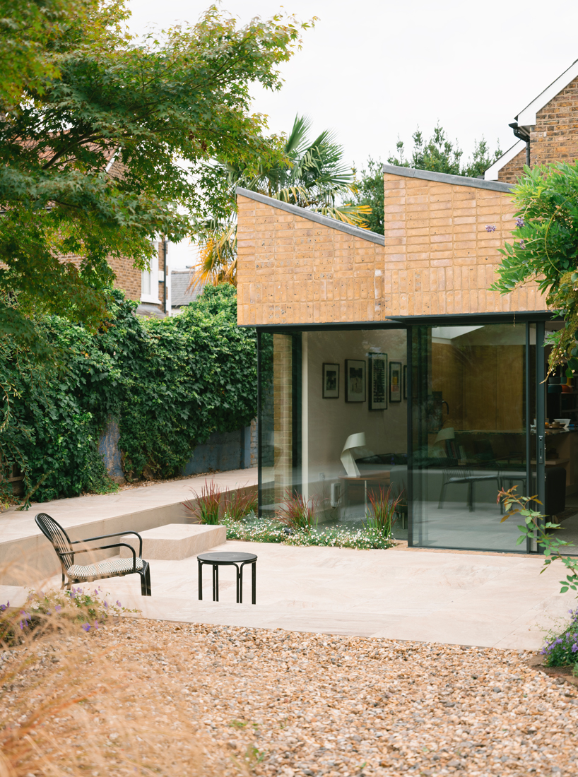 sawtooth house by francesco pierazzi architects reimagines a victorian home through a distinctive sawtooth roof 3