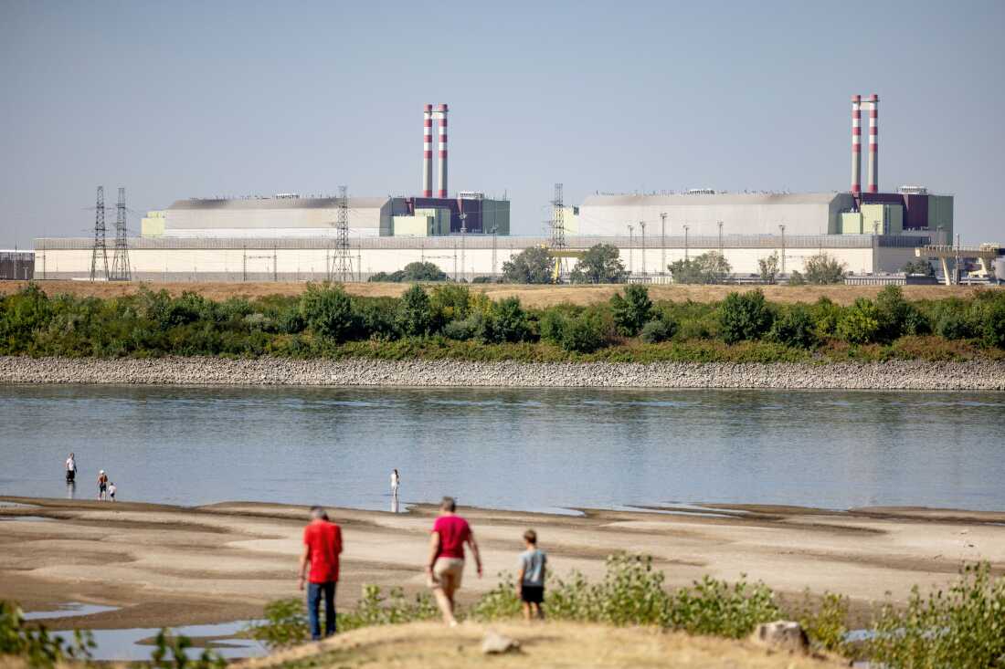 A view of Hungary’s Paks Nuclear Power Plant from the Danube embankment in Dunaszentbenedek on July 31, 2026. Record-low water levels on the Danube, driven by extreme heat and drought, have threatened the plant’s cooling system and highlighted Europe’s worsening climate crisis.