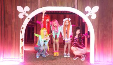 A screen capture from the official teaser for KiiiKiii’s third mini-album, WhyKiiiKiii, led by their high-energy summer title track