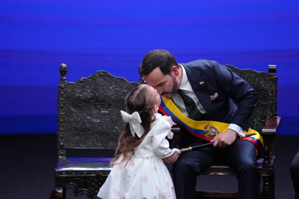 Francesca kisses her father, Colombia's President Abelardo de la Espriella, after he took the oath of office in Cali, Colombia, Friday, Aug. 7, 2026. (AP Photo/Matias Delacroix)