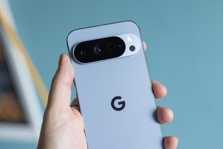 A hand holding the Pixel 10