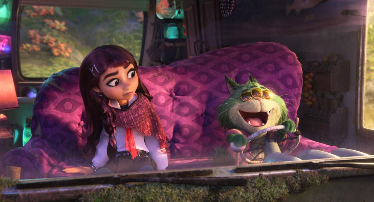 a girl sitting next to a three-eyed cat that is driving