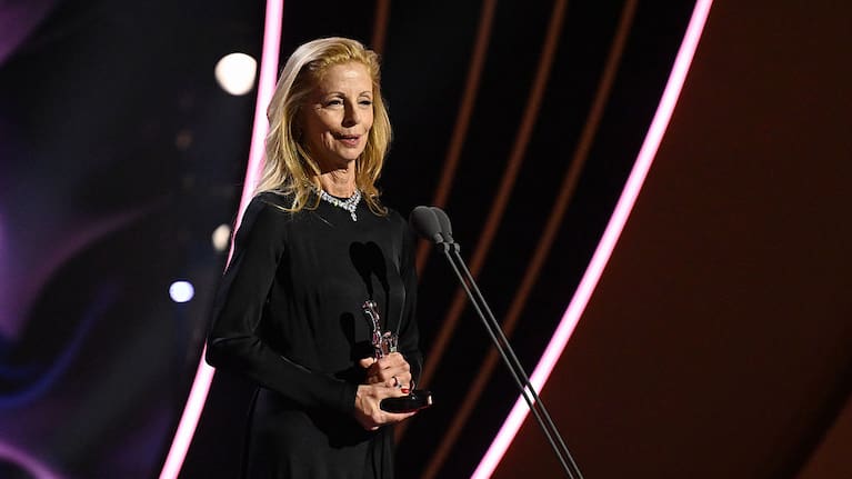 Heather Mitchell accepts the Silver Logie Award for Best Lead Actor in a Drama for "The Twelve: Cape Rock Killer" on behalf of Sam Neill during the 66th TV WEEK Logie Awards.
