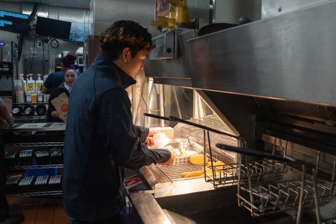 Jason Guevara, a kitchen manager, prepares hash browns.