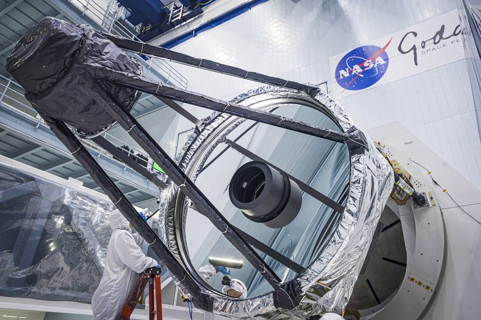 Big mirror of telescope with NASA Logo in Background