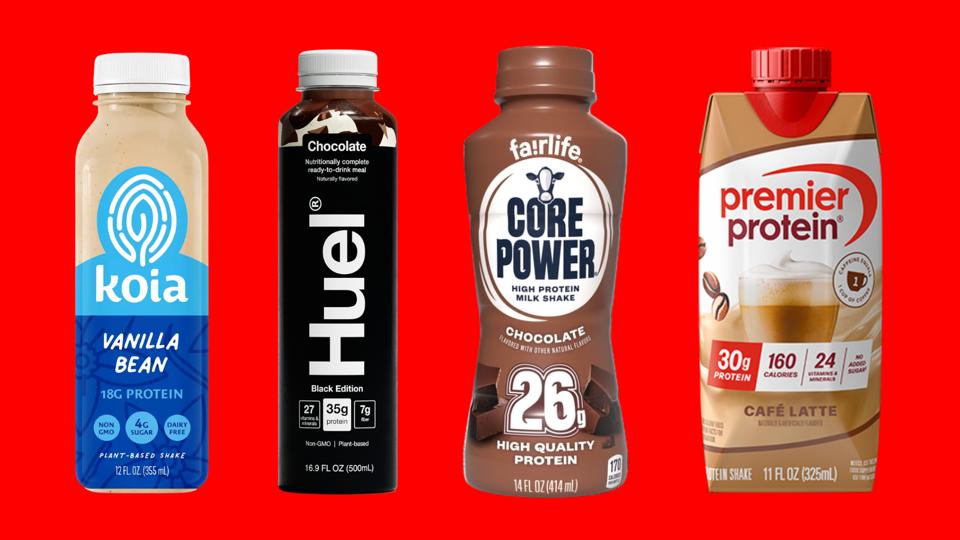 Four protein shakes against a bright red background.