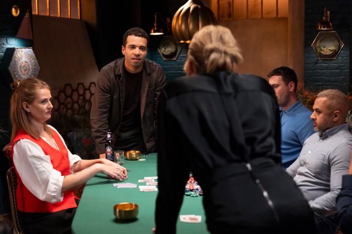 Ollie and Fiona give daggers towards one another during a poker game in Coronation Street