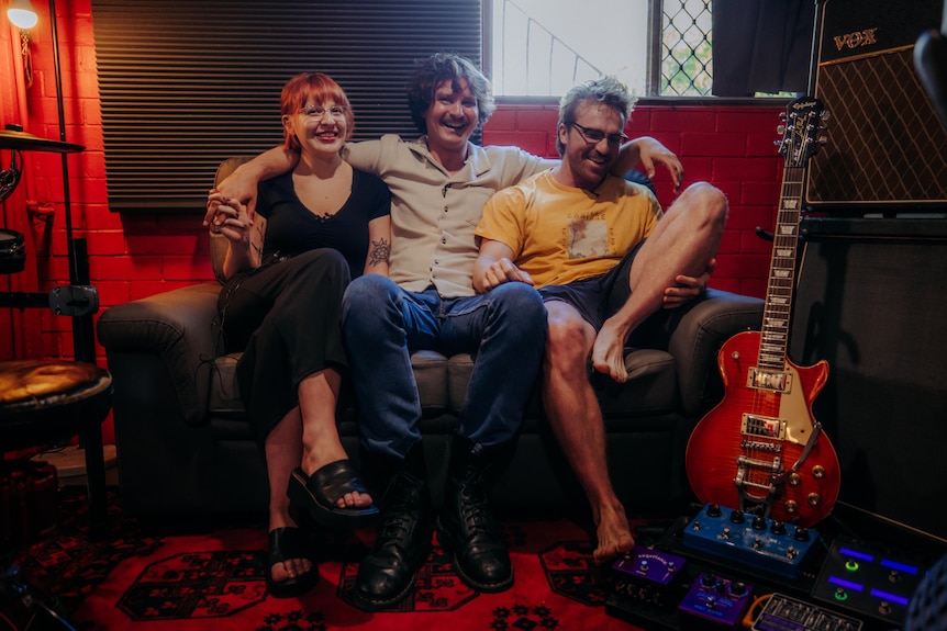 Jordan Brunoli with his partner Georgia and his bandmate Brock