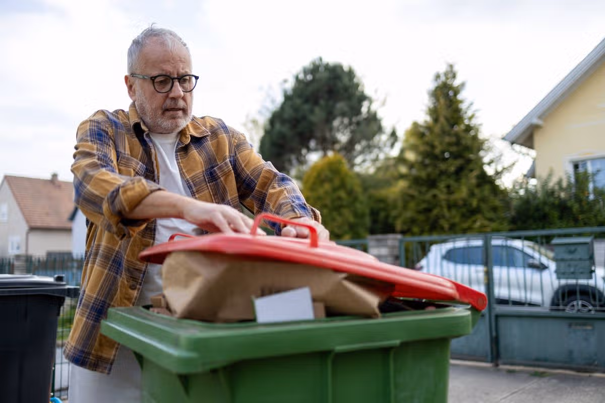 People separate waste at home for recycling, sorting garbage at home. Sustainable living concept, reusable resources, zero waste. Altpapier in Lower Austria