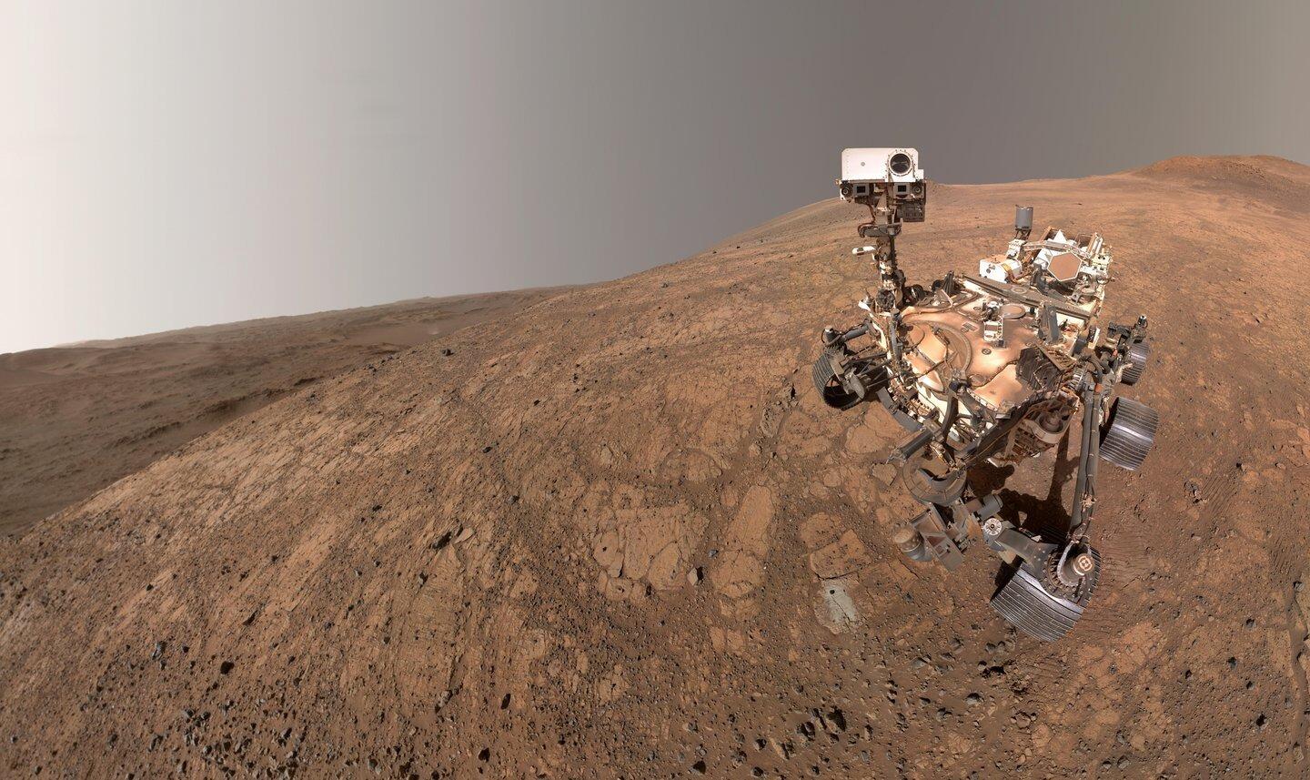 Perseverance rover on the rough red landscape of Mars