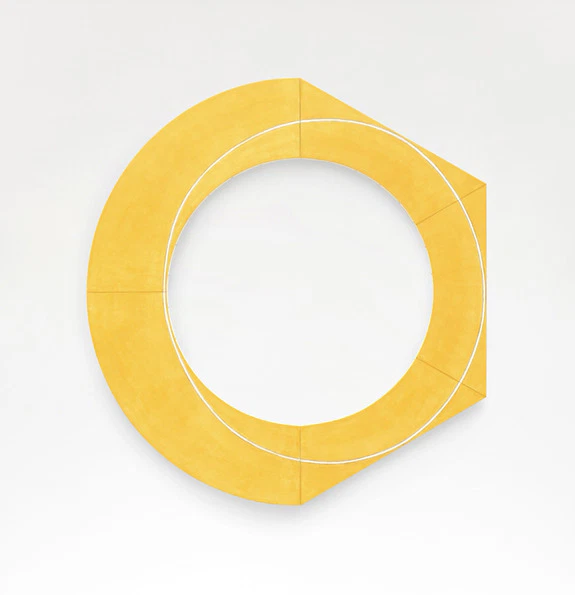 Yellow geometric sculpture shaped like a circular arc on a white background.