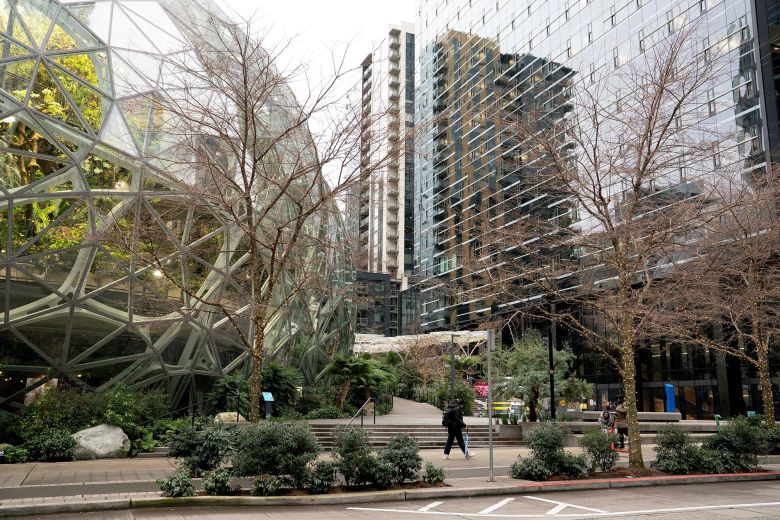 A person walks by the Spheres at Amazon’s headquarters campus in Seattle on January 28, 2026.