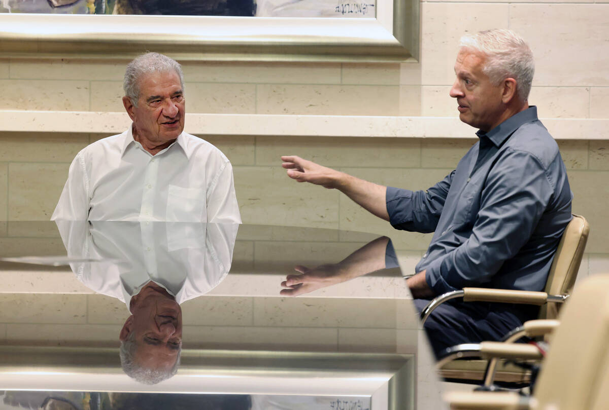Tony Marnell, left, founder and Chairman Emeritus of Marnell Companies, listens as David Howryl ...
