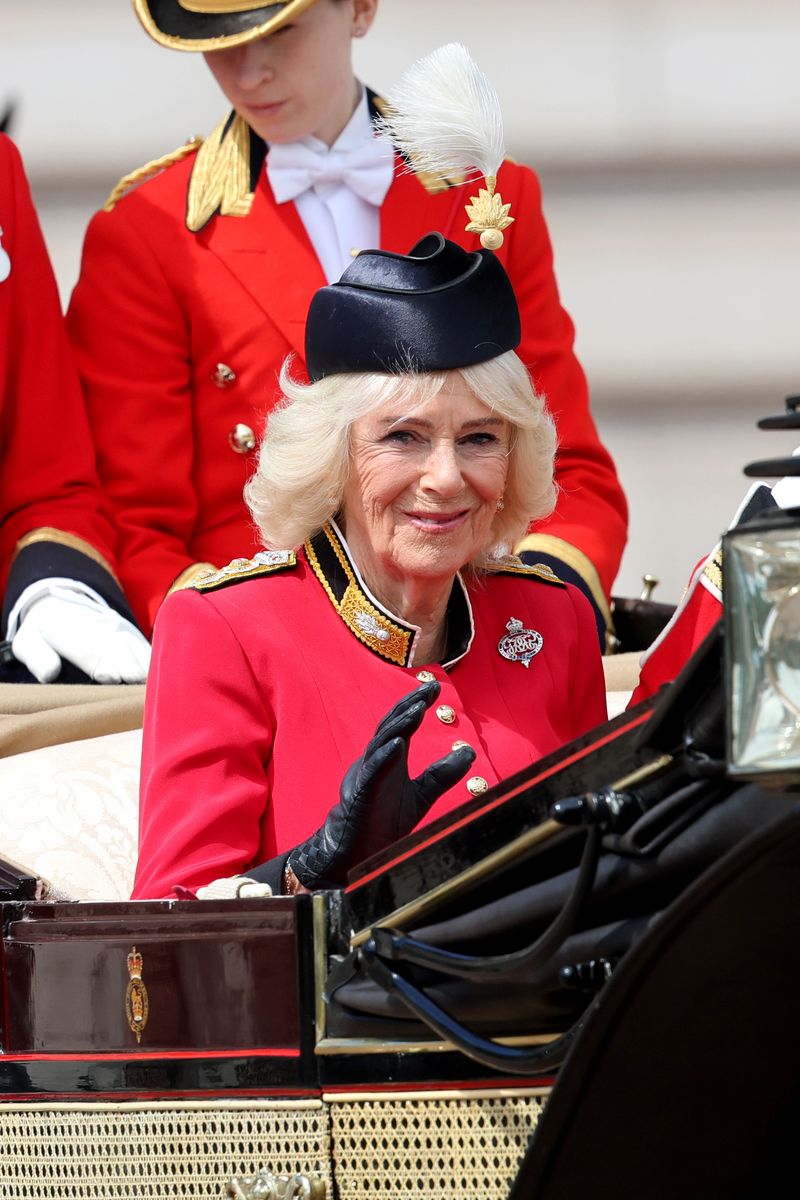 Queen Camilla complements King Charles with a striking red look at one of Britain's most important royal events.