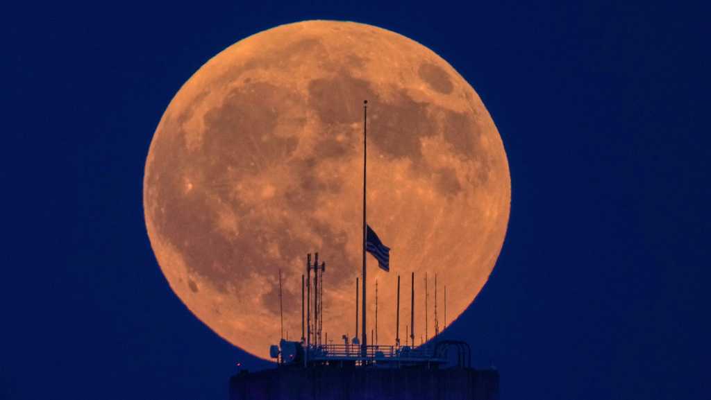 PHOTOS: Moon appears orange due to partial lunar eclipse