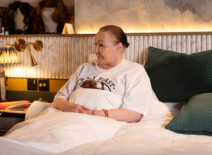 Celeste lay in bed in a scene from Coronation Street