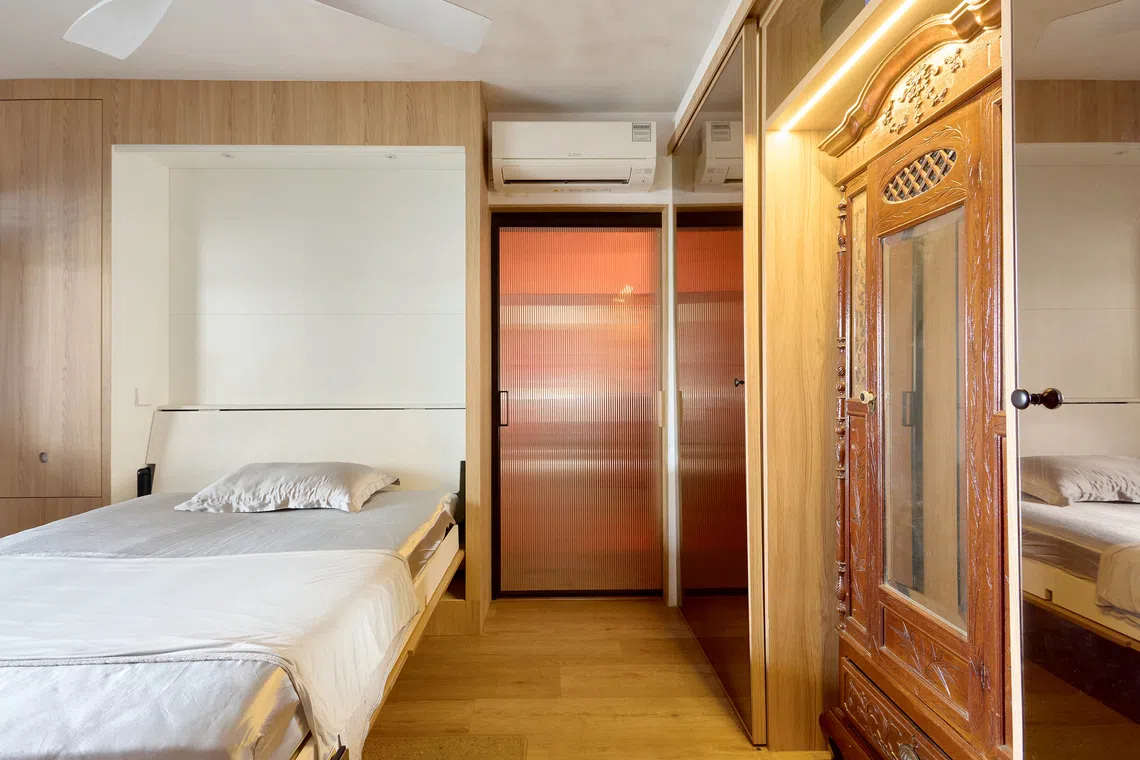 With its remote-controlled Murphy bed, the bedroom can be quickly converted into an exercise area or cat playroom.