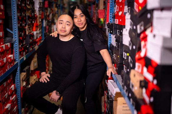 Streetwear entrepreneurs Justin Truong and Sandy Li, who have bought Stax, pose in their sneaker warehouse.