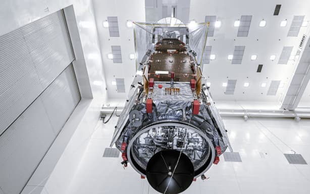 Technicians and engineers inside the Payload Hazardous Servicing Facility at NASA’s Kennedy Space Center in Florida use a crane to lift the agency’s Nancy Grace Roman Space Telescope to a specialized work stand Friday, June 26, 2026.
