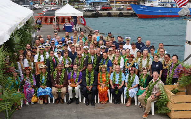 The crew of the Okeanos Explorer and invited guests pose for a group photo upon her welcome to Rarotonga.