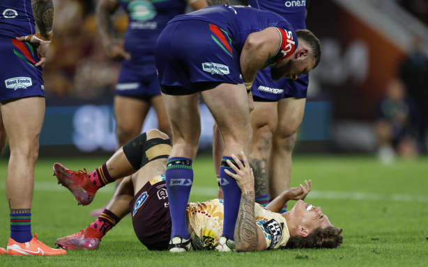 Reece Walsh of the Broncos lies injured during the round 24 NRL match between Brisbane Broncos and New Zealand Warriors at Suncorp Stadium, on August 15, 2026, in Brisbane, Australia. (Photo by Mackenzie Sweetnam/Getty Images)