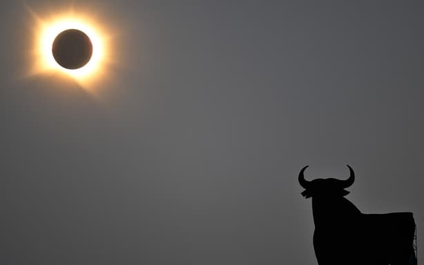 The Sun's corona glows as the Moon completely blocks the Sun during the totality phase of the total solar eclipse as seen from San Asensio, La Rioja region, on August 12, 2026. Millions of Europeans contemplated the sky in awe today during a rare total solar eclipse that will plunge a swathe of Spain into an eerie daytime darkness. The shadow cast when the Moon covers the Sun began in Russia's remote Arctic north at around 1700 GMT and continued in an arc through Greenland and Iceland. Spain is where most people viewed the total eclipse, which crossed the country diagonally from the northern Atlantic coast to the Mediterranean Sea, where it vanished at around 1830 GMT. (Photo by Ander Gillenea / AFP)