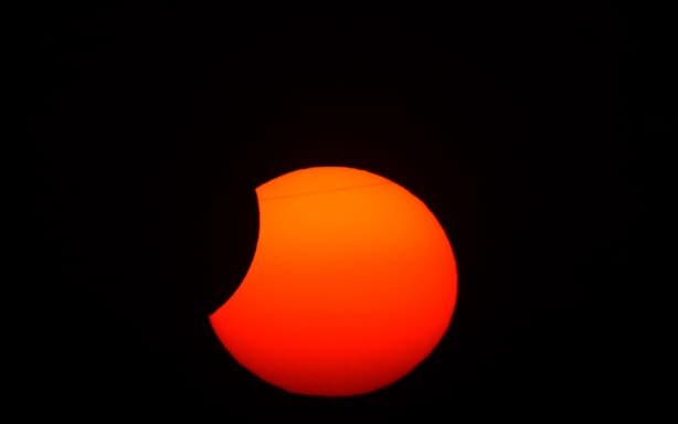 The Moon uncovers the Sun in the moments following totality of the solar eclipse as seen from Lodoso, Burgos province, on August 12, 2026. Millions of Europeans contemplated the sky in awe today during a rare total solar eclipse that will plunge a swathe of Spain into an eerie daytime darkness. The shadow cast when the Moon covers the Sun began in Russia's remote Arctic north at around 1700 GMT and continued in an arc through Greenland and Iceland. Spain is where most people viewed the total eclipse, which crossed the country diagonally from the northern Atlantic coast to the Mediterranean Sea, where it vanished at around 1830 GMT. (Photo by Cesar MANSO / AFP)