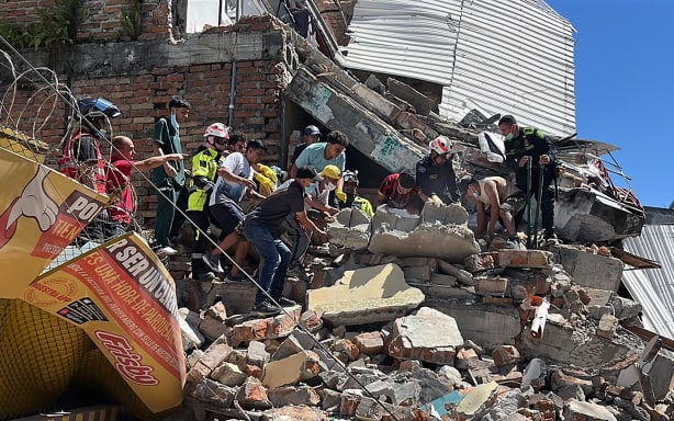 Rescuers look for survivors at a collapsed building after an earthquake in Pereira, Colombia on August 10, 2026. A powerful earthquake rocked Colombia and neighboring Latin American countries on August 10, 2026, with medical teams rushing to help victims after buildings were damaged or collapsed in several cities. The Colombian geological service and its American counterpart USGS put the magnitude at 7.4, with an epicenter 100 km (60 miles) underground in the west of the country. Colombia had initially put it at 6.6.
