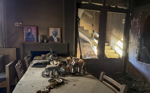This photograph shows a destroyed hotel after a wildfire at the village of Agios Pavlos in the Greek island of Crete on July 30, 2026. Greece on July 30, 2026 battled to contain a spate of wildfires, including on the tourist island of Crete that forced thousands of locals and holidaymakers to evacuate, and left three firefighters dead. The Crete fire, south of the city of Rethymno, had forced officials to evacuate some 8,000 people overnight as it threatened the village resort of Agia Galini. (Photo by Will VASILOPOULOS / AFP)