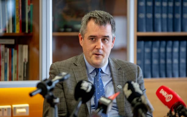 Housing Minister Chris Bishop announcing a major social housing shake-up at Parliament on 21 May 2026.