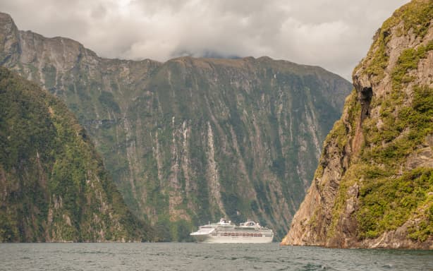Milford Sound, New Zealand February 14, 2012: Cruise ship cruising in Milford Sound. This fiord is considered as one of the most scenic places in the world.