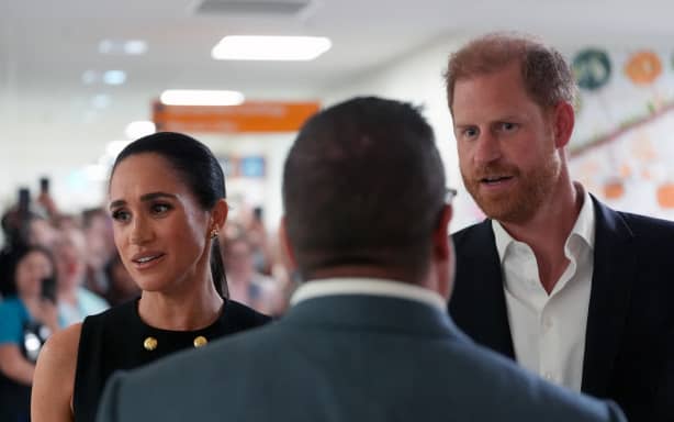 Britain's Prince Harry (R), Duke of Sussex, and his wife Meghan (L), the Duchess of Sussex, visit the Royal Children's Hospital in Melbourne on April 14, 2026. (Photo by Jonathan Brady / POOL / AFP)