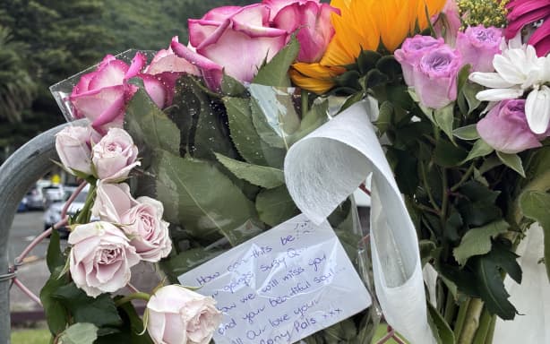 A floral tribute left for Susan Knowles at the Mt Maunganui landslide cordon.