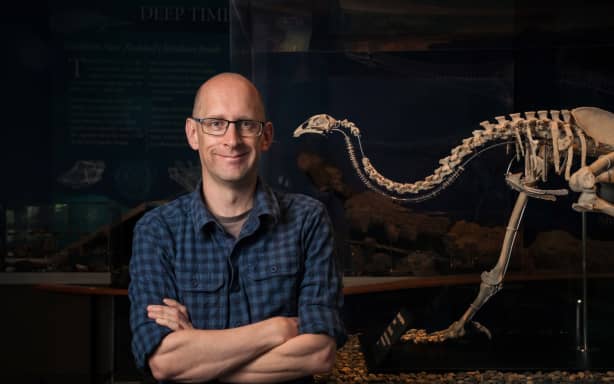 University of Otago Associate Professor Nic Rawlence and a moa skeleton.