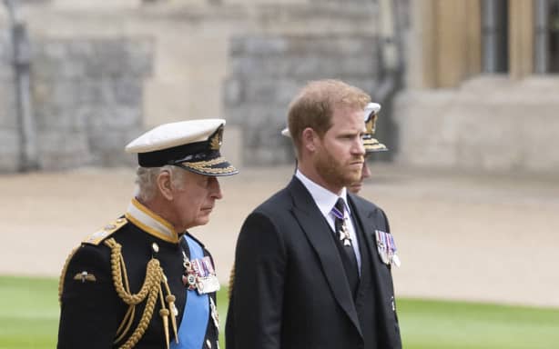 Britain's King Charles III (L) walks with his son Britain's Prince Harry, Duke of Sussex as they arrive at St George's Chapel inside Windsor Castle on September 19, 2022, ahead of the Committal Service for Britain's Queen Elizabeth II. Monday's committal service is expected to be attended by at least 800 people, most of whom will not have been at the earlier State Funeral at Westminster Abbey. (Photo by David Rose / POOL / AFP)