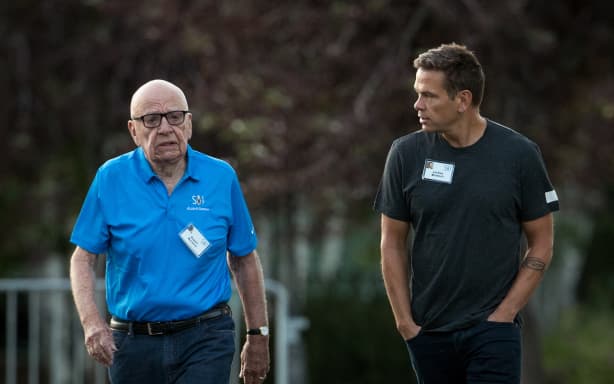 SUN VALLEY, ID - JULY 13: (L to R) Rupert Murdoch, executive chairman of News Corp and chairman of Fox News, and Lachlan Murdoch, co-chairman of 21st Century Fox, walk together as they arrive on the third day of the annual Allen & Company Sun Valley Conference, July 13, 2017 in Sun Valley, Idaho. Every July, some of the world's most wealthy and powerful businesspeople from the media, finance, technology and political spheres converge at the Sun Valley Resort for the exclusive weeklong conference. Drew Angerer/Getty Images/AFP (Photo by Drew Angerer / GETTY IMAGES NORTH AMERICA / Getty Images via AFP)