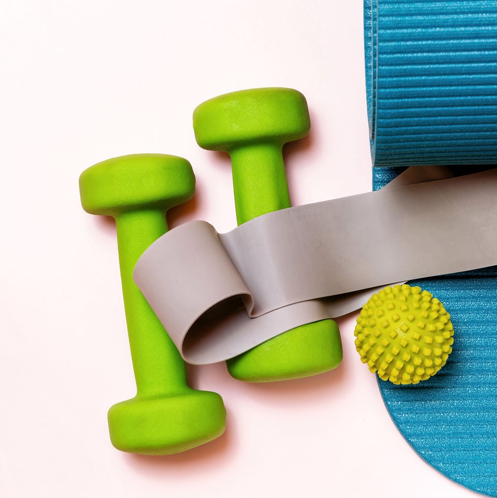 Essential fitness gear for home workouts essential fitness gear for home workouts: dumbbells, yoga mat, resistance band, massage ball. perfect for health, strength, and active living