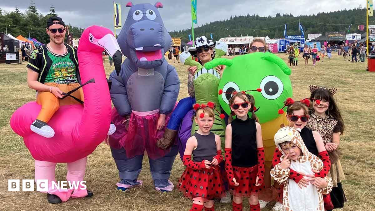 The families are dressed in blow-up animal costumes and polka dot dresses and animal print onsies.
