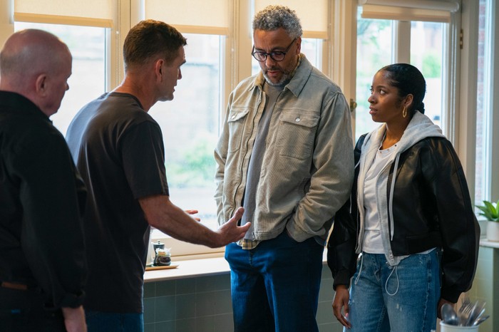 Jack talks to Darnell and Grace in the gaming grounds in a scene from EastEnders
