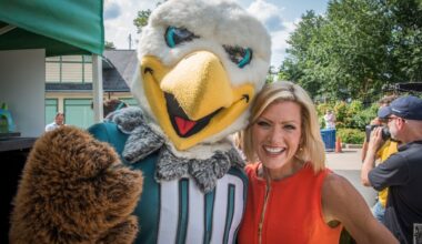Cecily Tynan, seen here with Eagles mascot Swoop, is retiring after more than 30 years at 6abc.