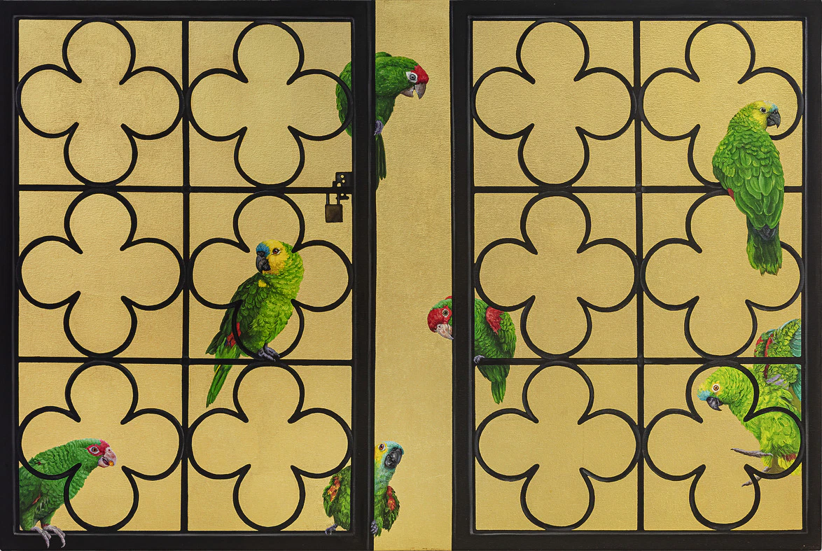Colorful parrots perched on a decorative wrought iron fence with a golden backdrop.