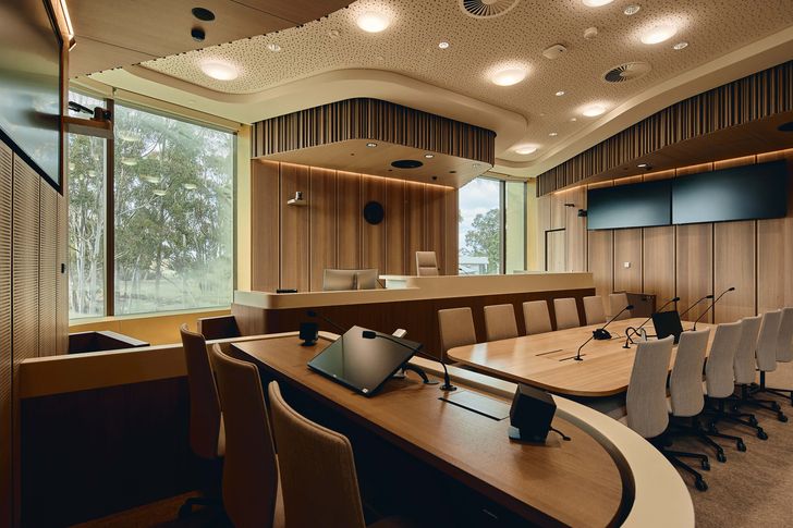 Warm, natural material finishes help to create a calm atmosphere in courtrooms and hearing spaces.