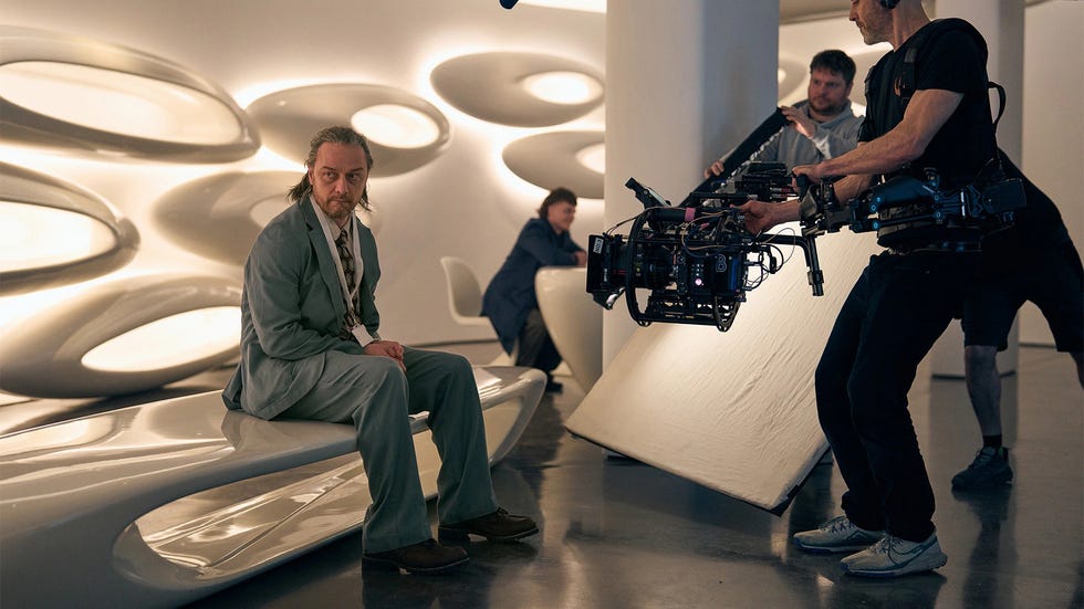 filming scene with crew and actor in futuristic setting. filming scene with crew and actor in futuristic setting.