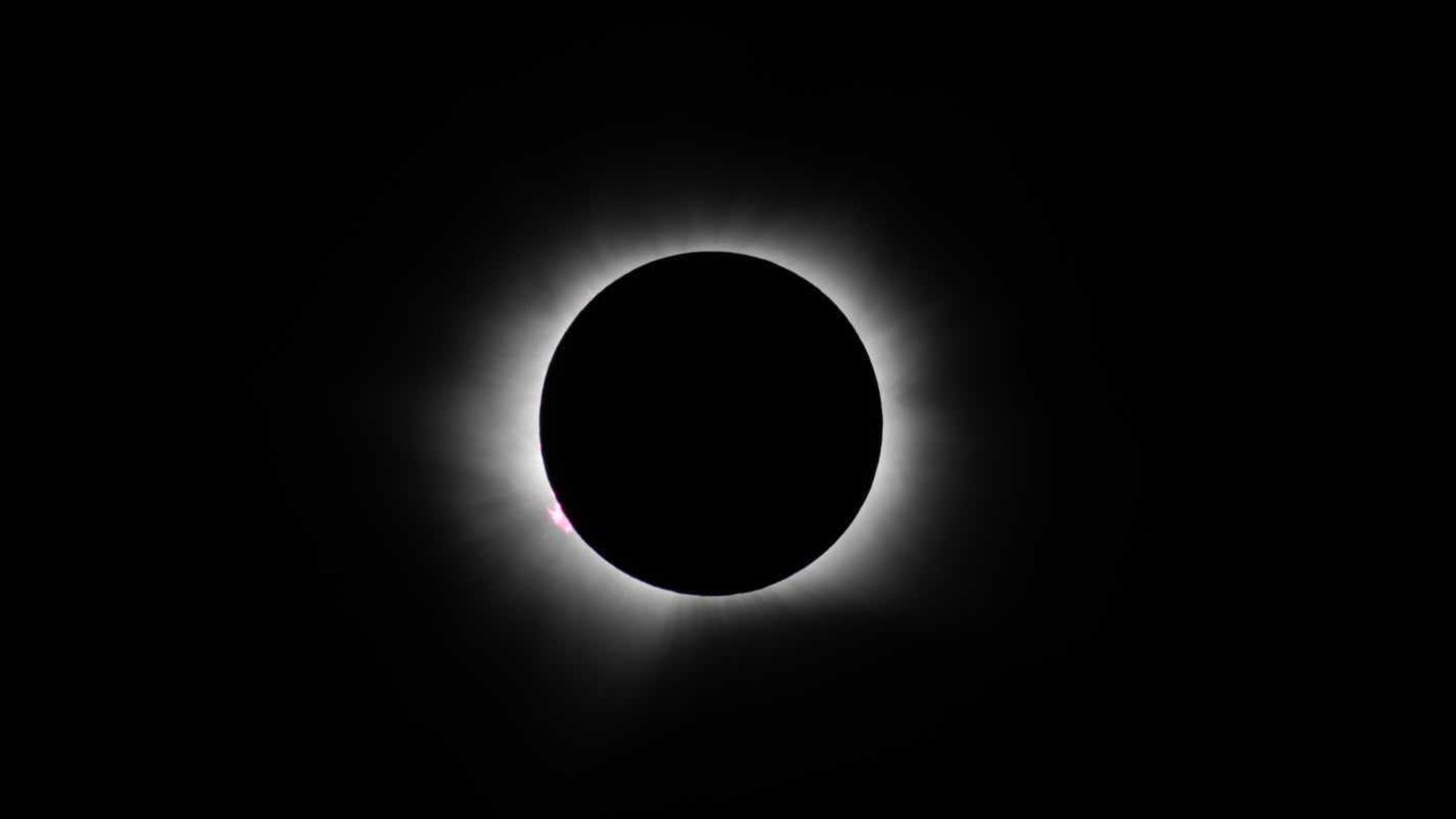 a white outline of the sun in the sky