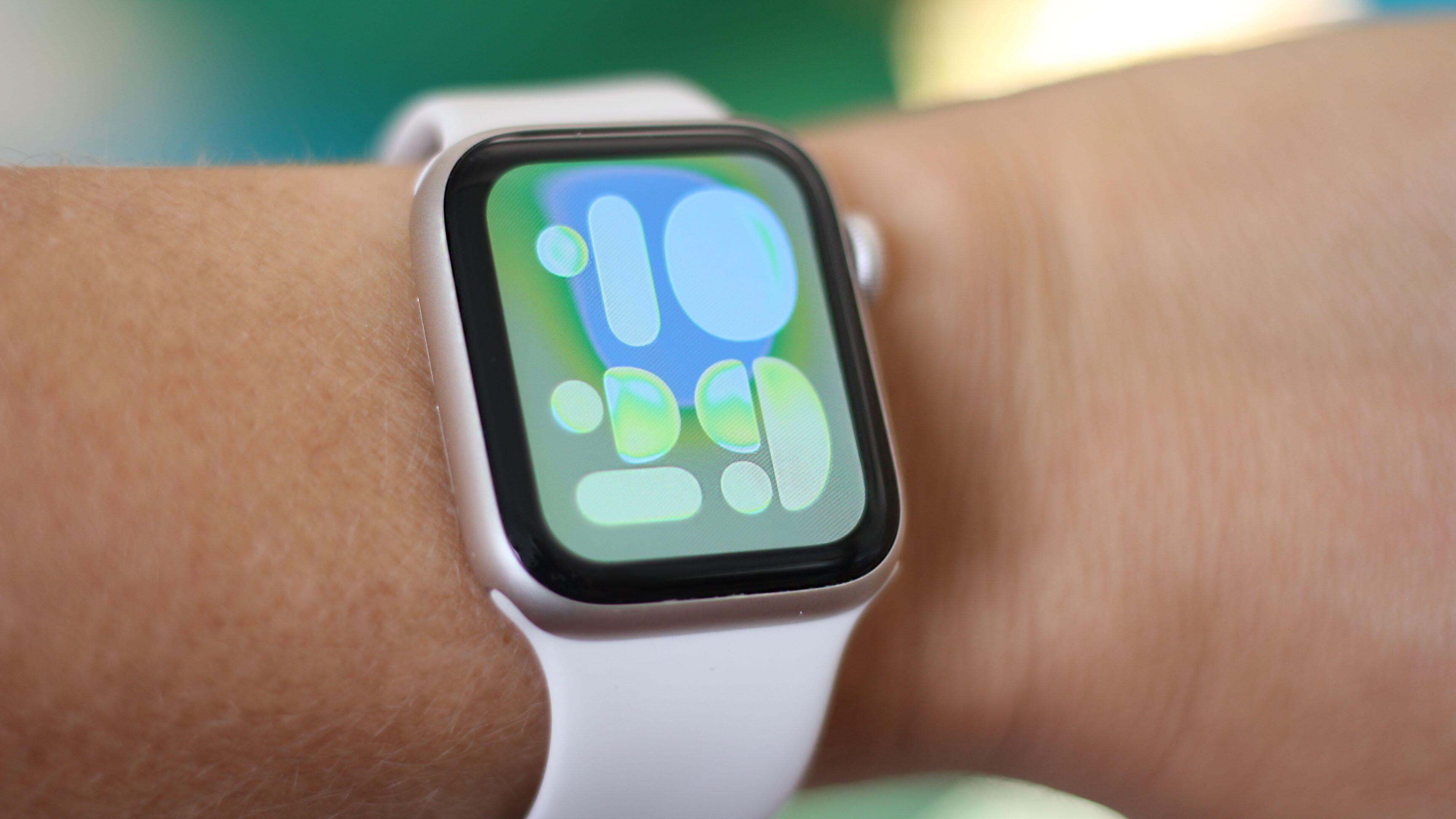Apple Watch SE on wrist showing compass app