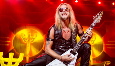 Richie Faulkner playing guitar on stage