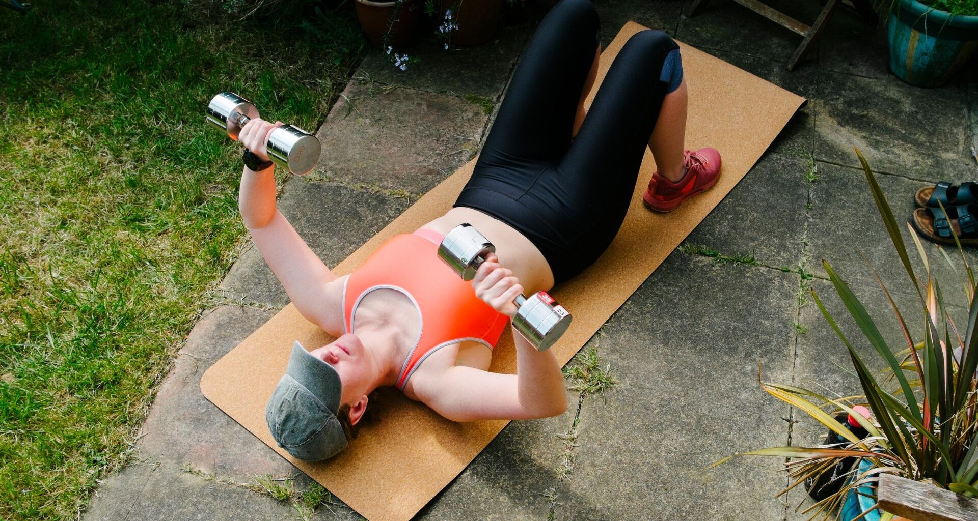 Woman doing floor chest press to learn how to do push-ups for beginners