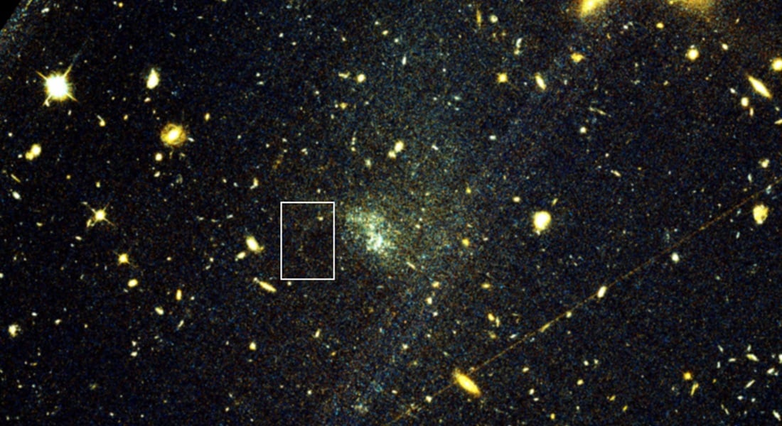 A Hubble Space Telescope view of the ultra-diffuse galaxy UGC9050-Dw1 and a stream of stars from an associated globular cluster. The stream is shaped by the influence of dark matter. Credit: STScI, Holm, et al.